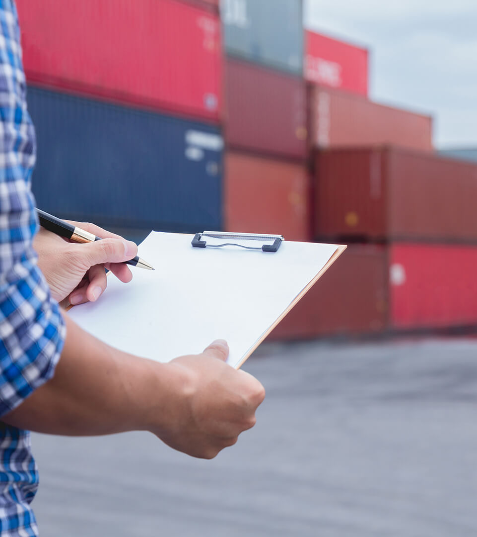 Close-up of Industrial engineers hand , look at project blueprints while standing at port