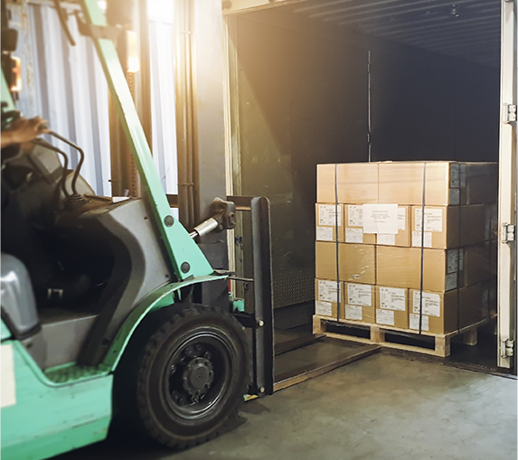 Forklift loading shipment goods pallet into container shipping truck. Cargo freight, Logistics and transportation.